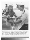 Actress Angel Tompkins and actor Lloyd Bridges on a boat